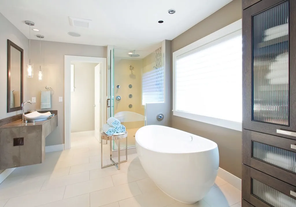Bathroom with a glass shower enclosure and vanity mirror