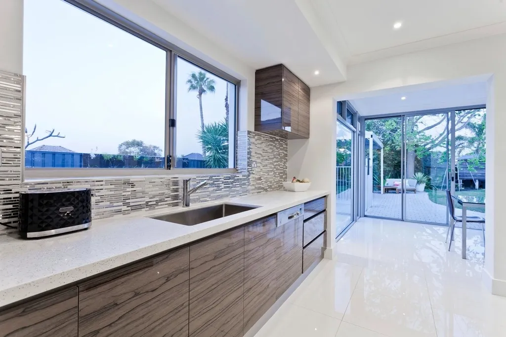 Modular kitchen with wood-finish drawers and cabinets