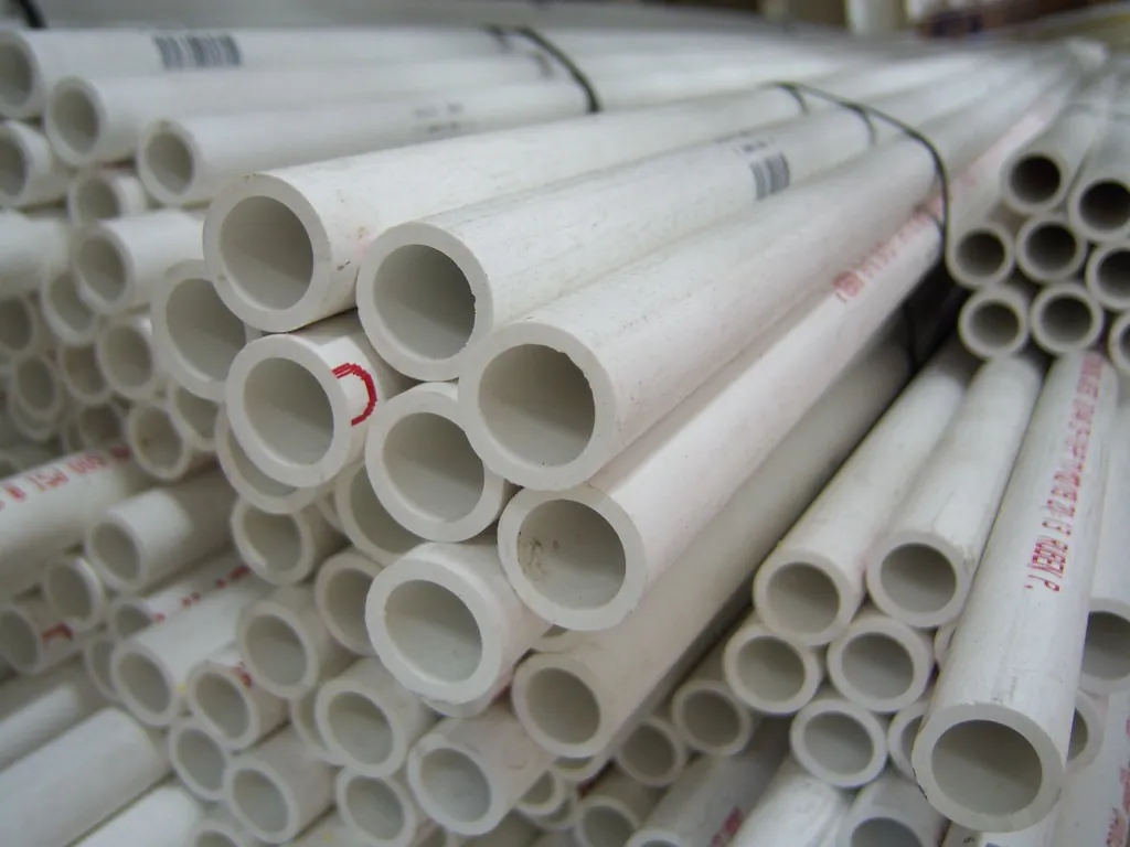 A stack of white PVC pipes seen end-on