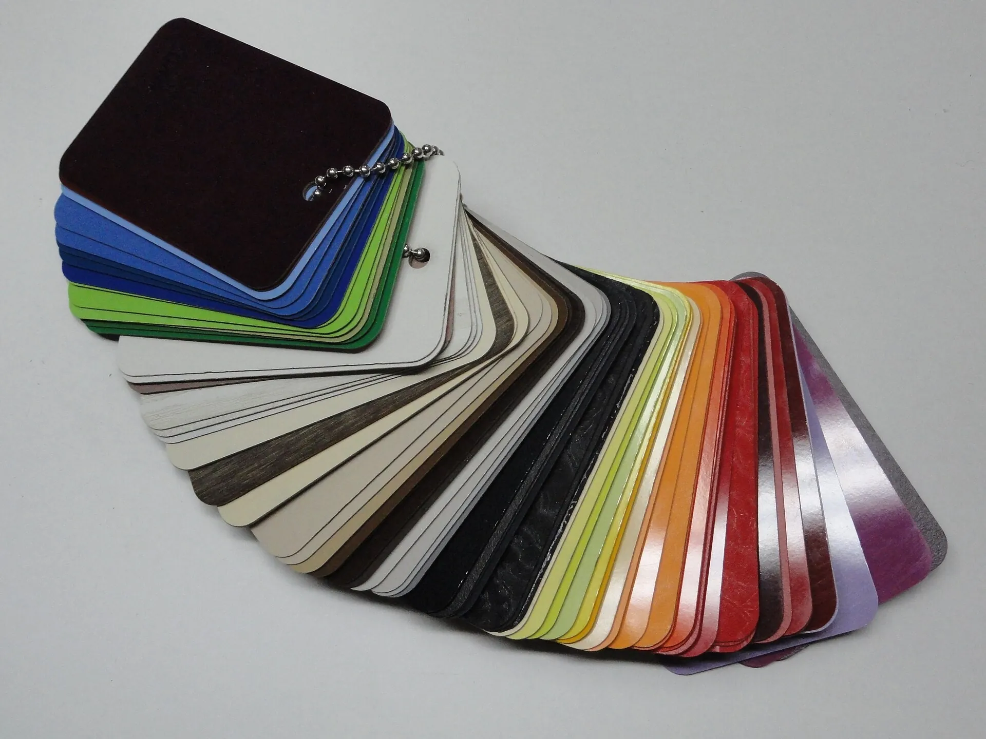Fan of coloured decorative panel samples